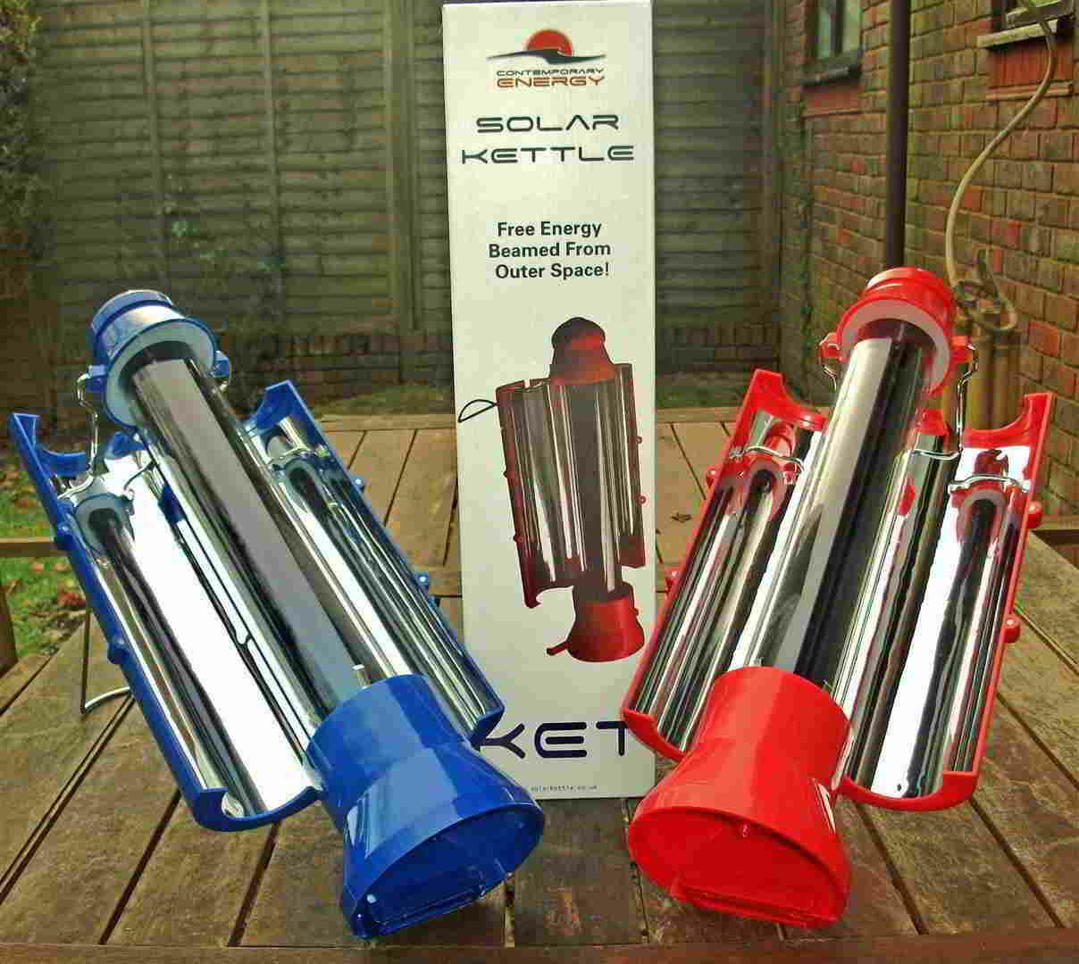 Red and blue solar kettles with extended reflectors